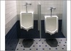 A Picture of product 963-047 Cleanshield Urinal Mats. Charcoal color. 6 count.